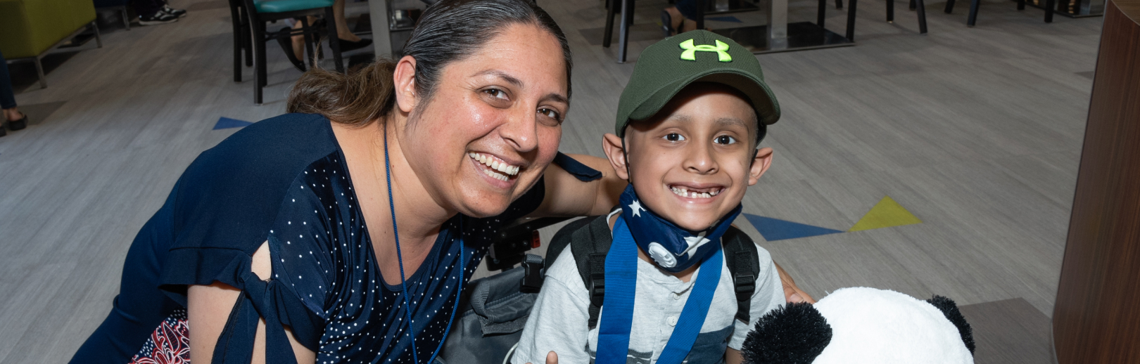 Mom and son smiling together
