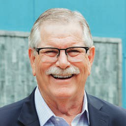 Portrait of Chuck Day, smiling.
