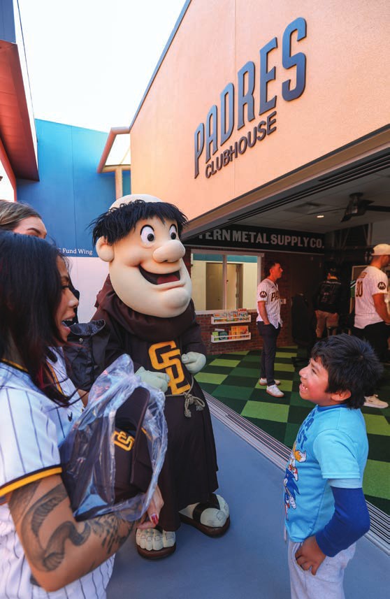 The San Diego Padres’ Swinging Friar mascot greets a young guest.